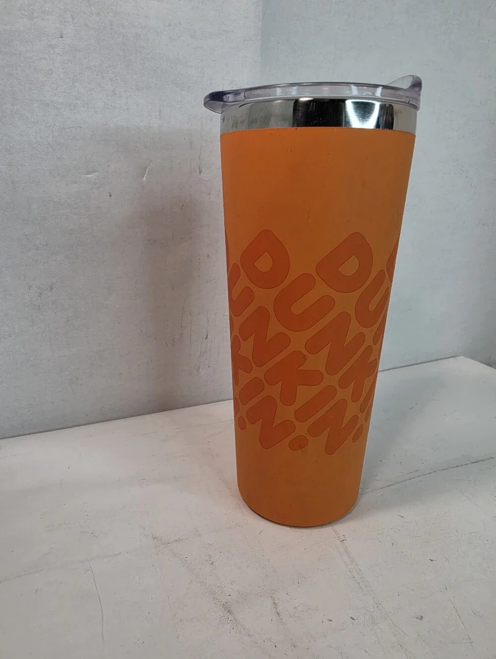 Dunkin' 20 oz Insulated Stainless Steel Tumbler, vibrant orange soft touch grip.